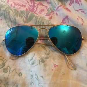 Gold Rayban sunglasses with blue reflective lenses